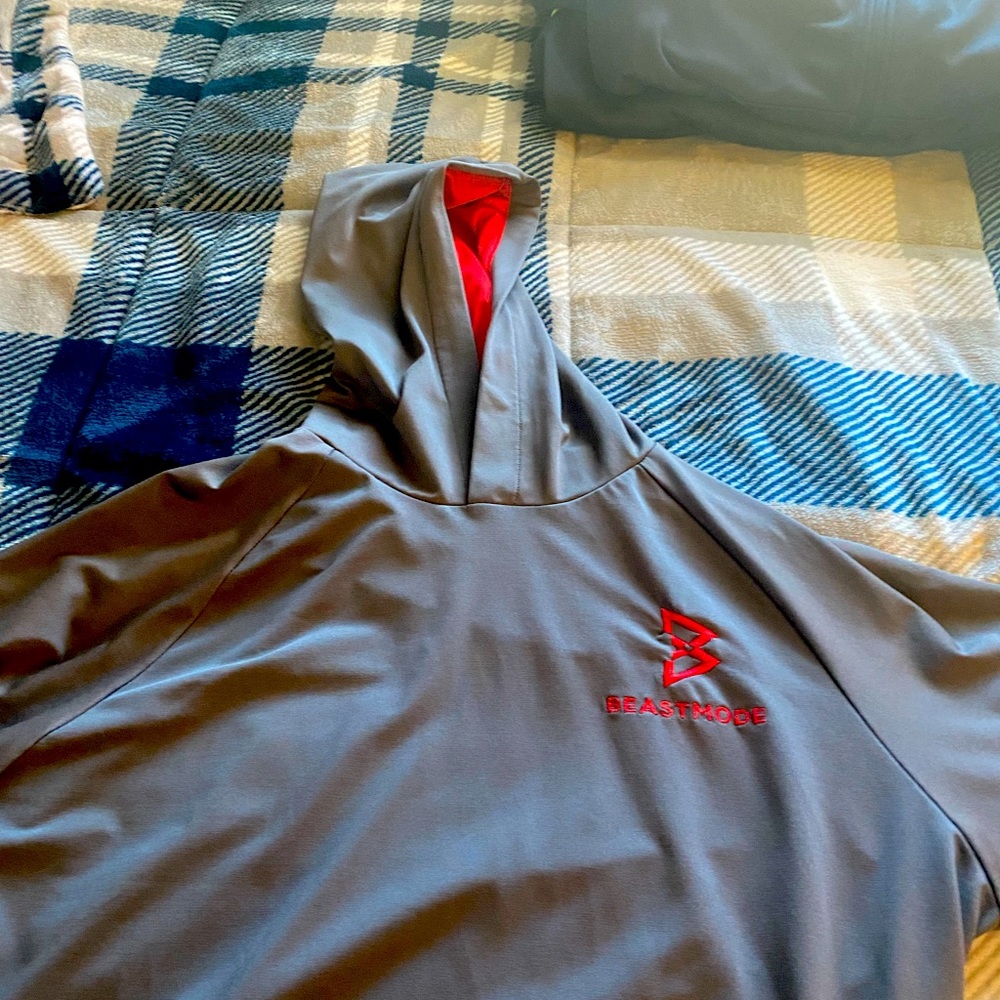 BeastMode/ Marshawn Lynch pullover hoodie. Gray with red lining, Size XL.